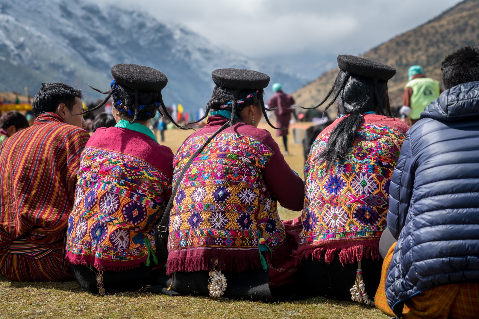 Photos of the Royal Highlander Festival in Bhutan - Monpa yak hair hats and embroidered vests - Lost With Purpose travel blog