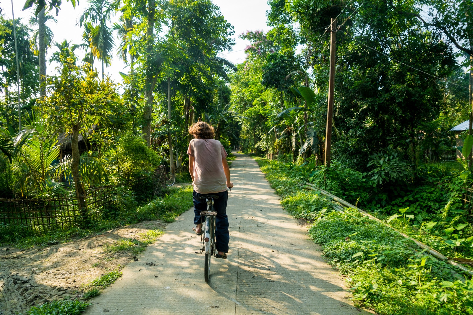 Foreign tourist cycling around Majuli river island