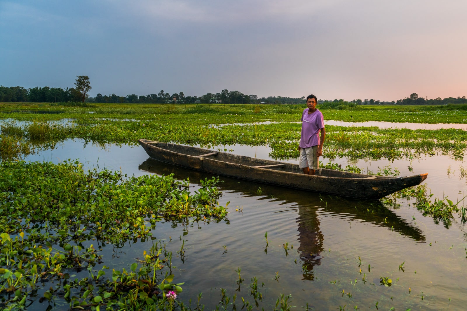 Local fisherman in a boat in Majuli river island