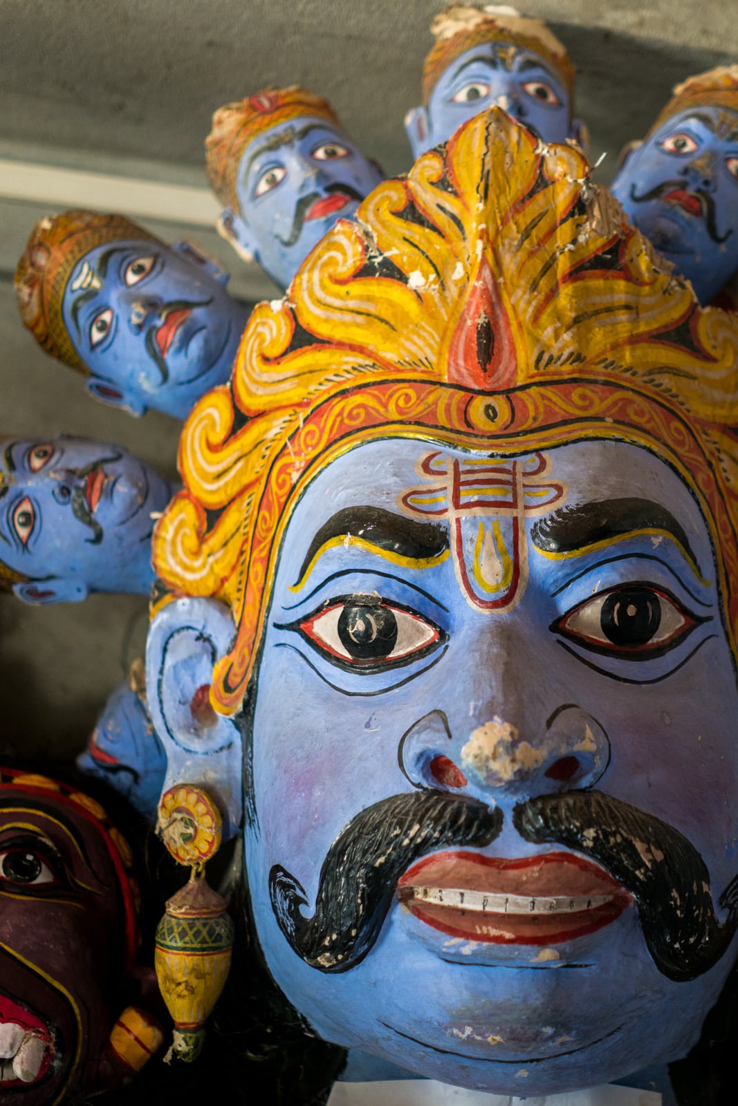 A traditional hand painted mask at one of the many Vaishnavite satras, Hindu monasteries, on Majuli river island in Assam, Northeast India.