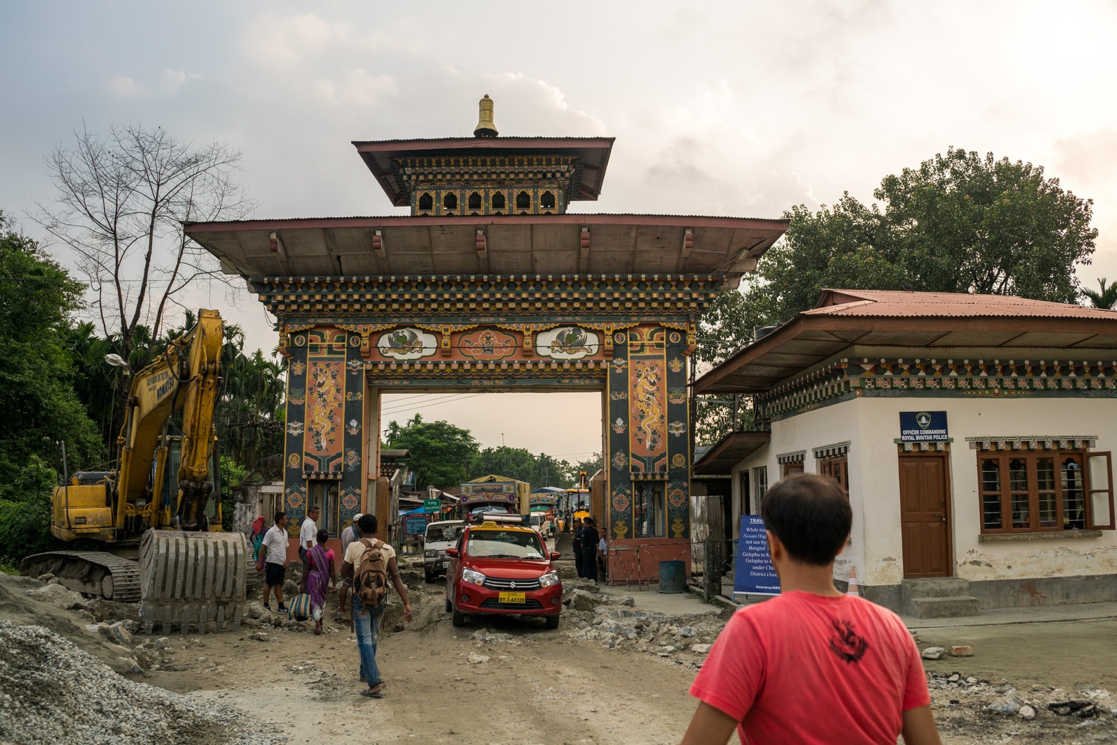 Border gate and cars between the India - Bhutan border crossing at Gelephu - Lost With Purpose travel blog