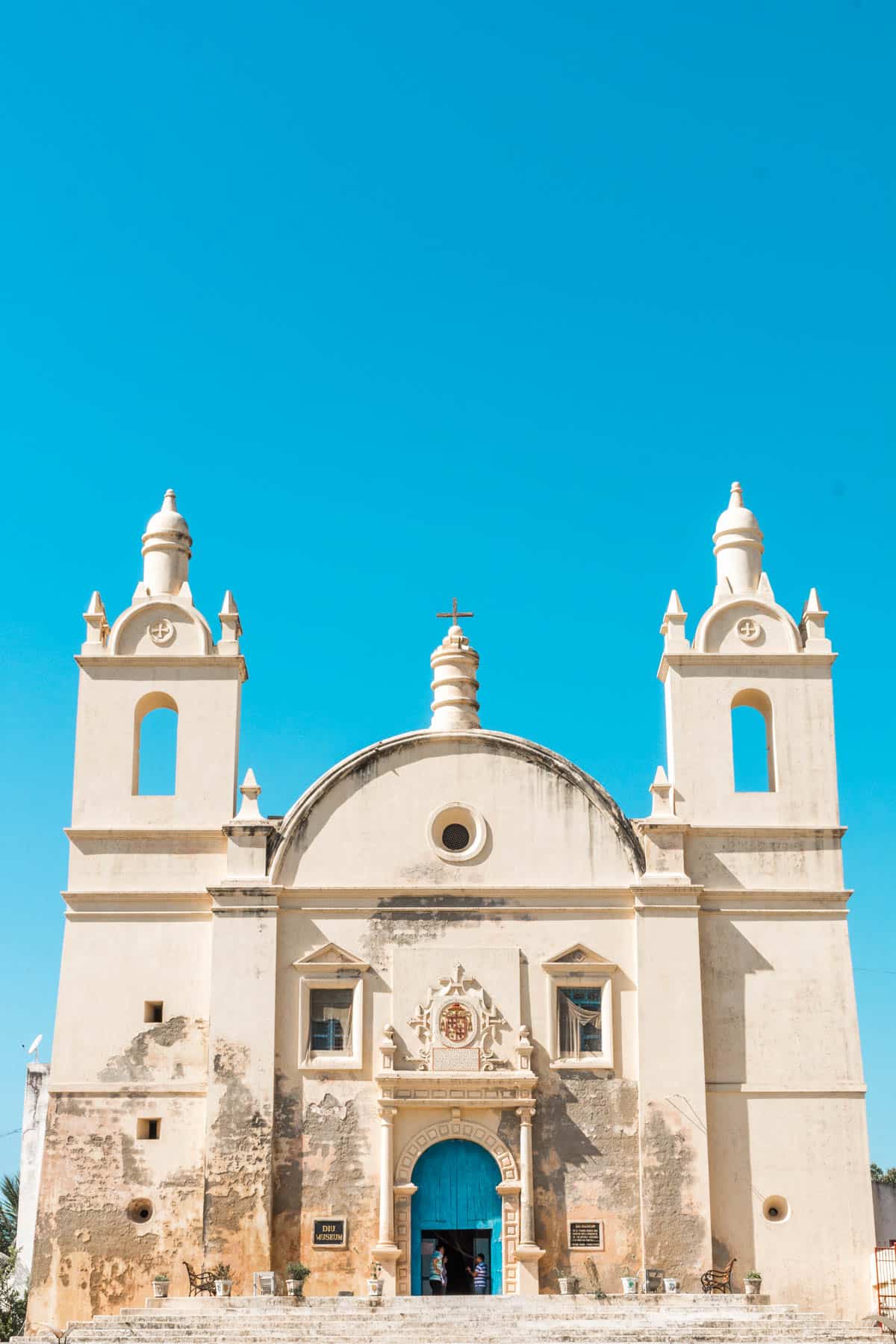 Blue skies over a Portuguese church on Diu island, India. A great off the beaten track destination in India if you're looking for a bit of comfortable rest and relaxation, and the perfect Goa alternative.