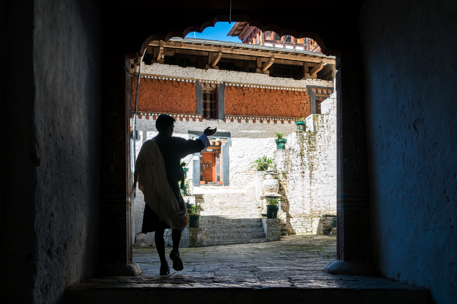 What's it like to go on a guided tour in Bhutan - Karma showing us the Trongsa dzong - Lost With Purpose travel blog