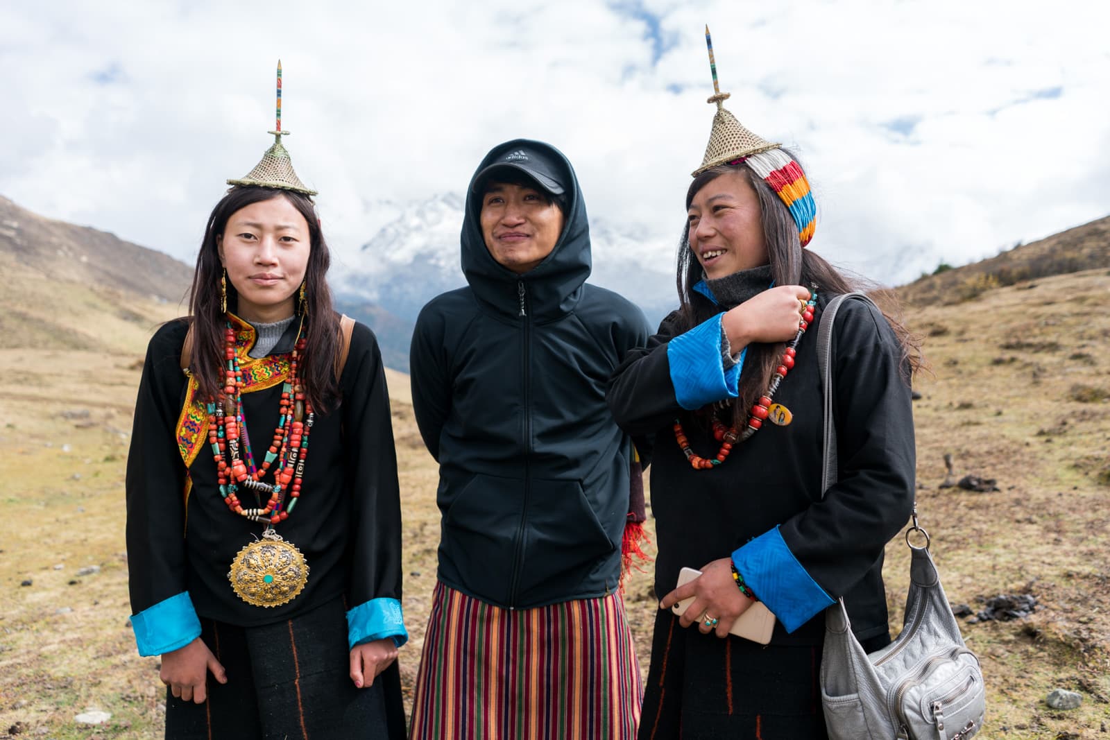 Guide Karma posing with Layap women at the Royal Highlander Festival