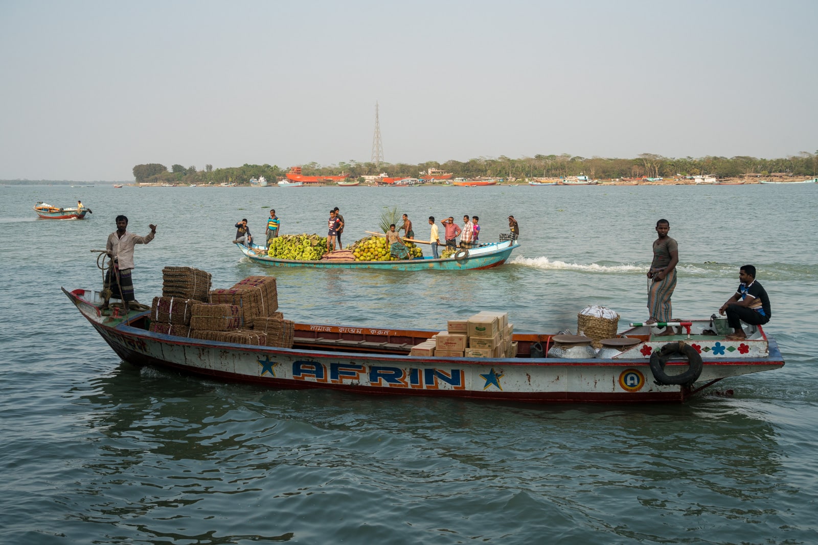 How to get a launch boat from Khulna to Dhaka via Hularhat - Boats passing by on the river in Bangladesh - Lost With Purpose travel blog