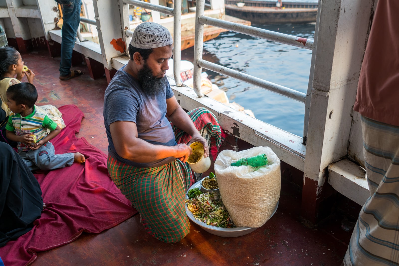 Guide to launches in Bangladesh - Man making jhal muri puffed rice - Lost With Purpose travel blog