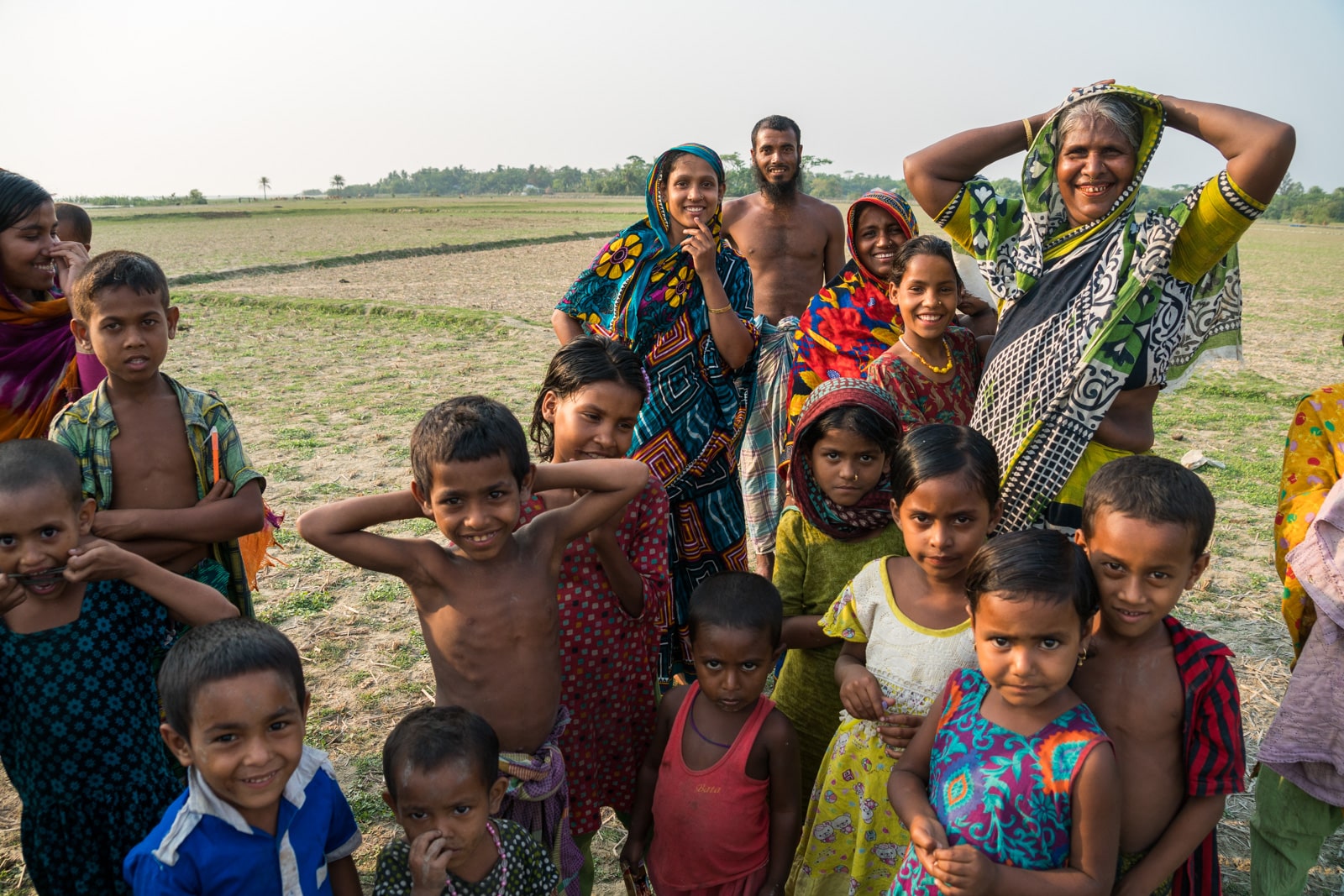 Travel guide to Nijhum Dwip, Bangladesh - Group of curious villagers - Lost With Purpose travel blog