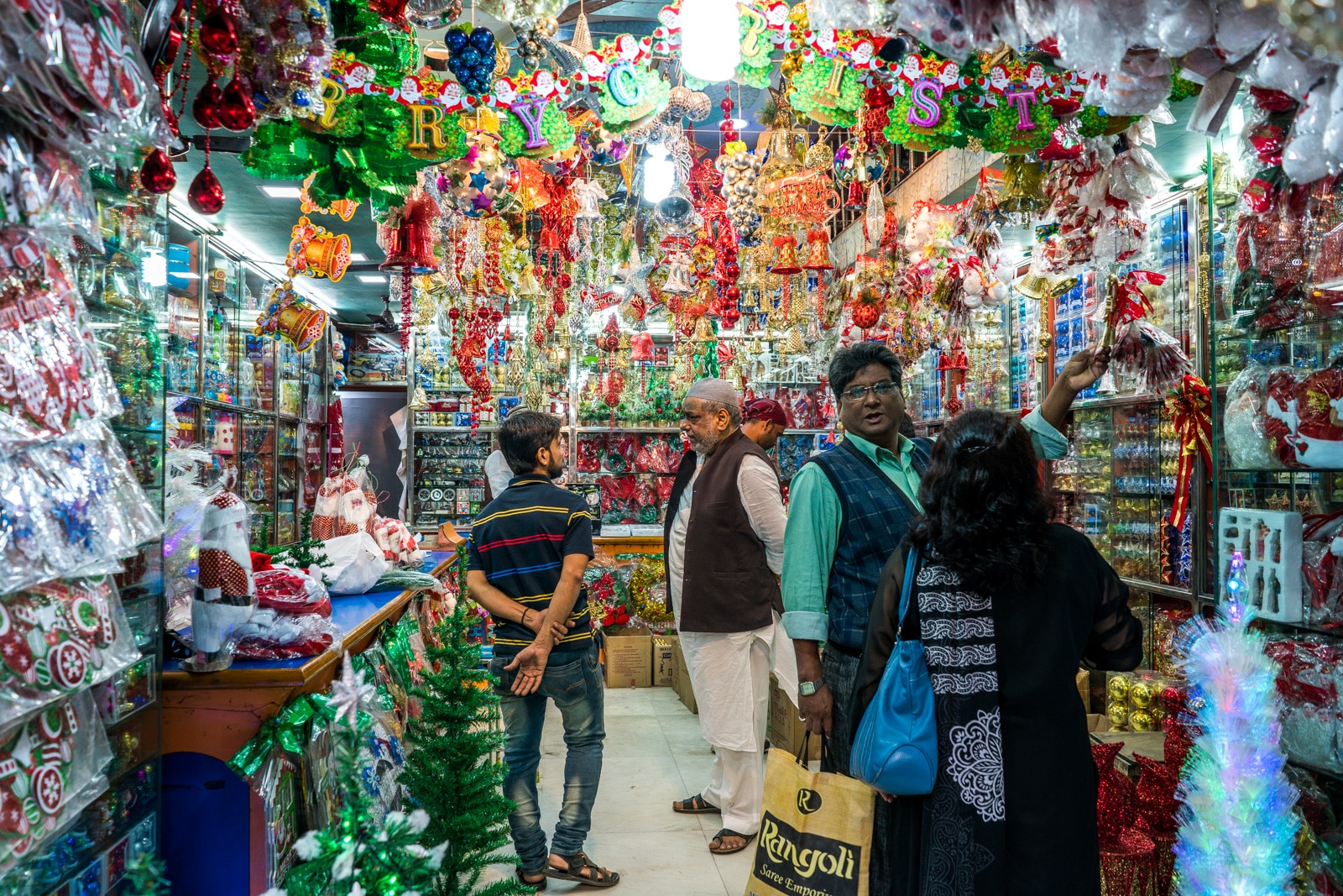 Celebrating Christmas in Kolkata, India - Muslim man selling Christmas decorations on Mirza Ghalib street - Lost With Purpose travel blog