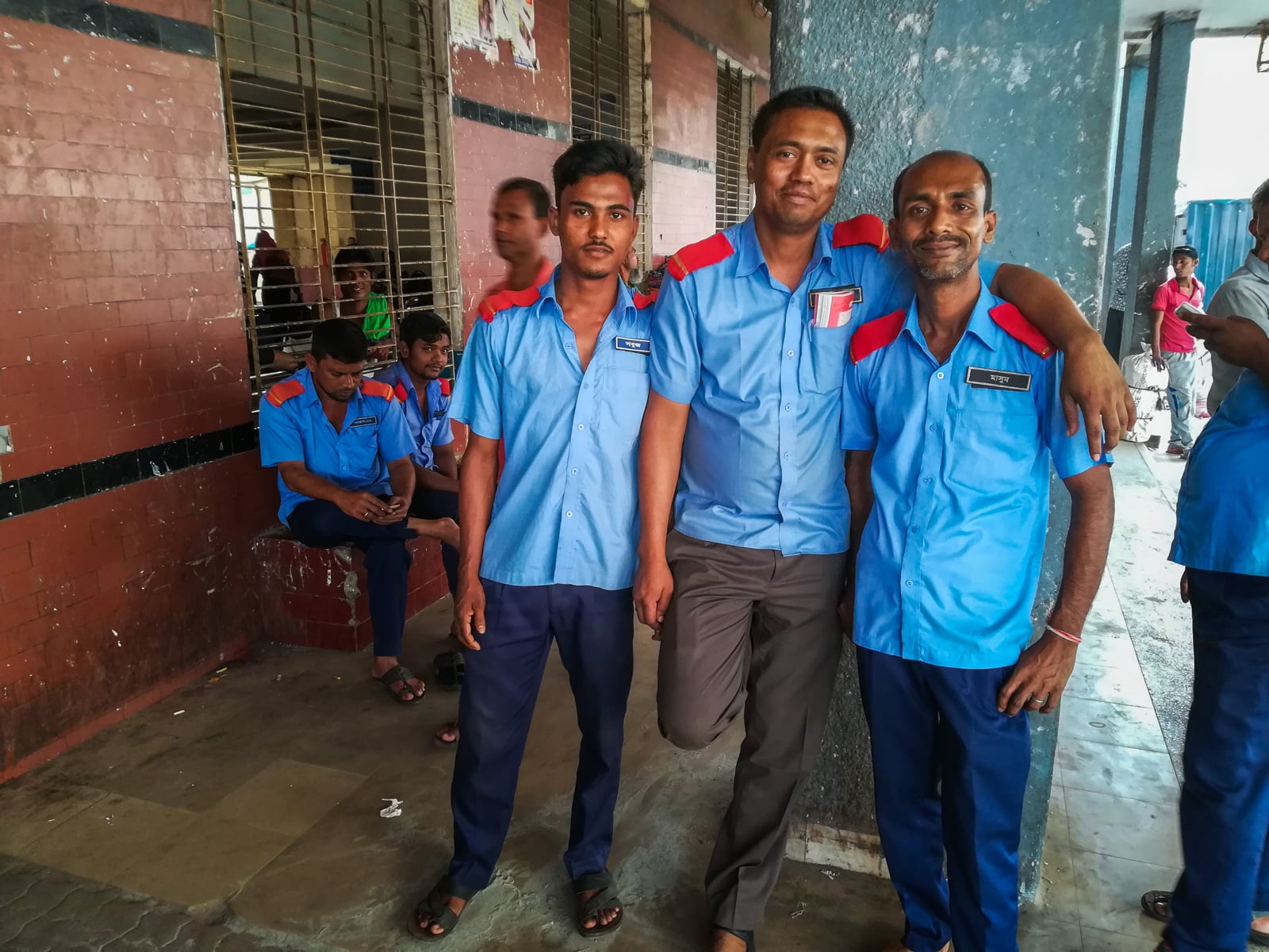 How to buy launch tickets in Dhaka, Bangladesh - Friendly porters at Sadarghat launch terminal - Lost With Purpose travel blog