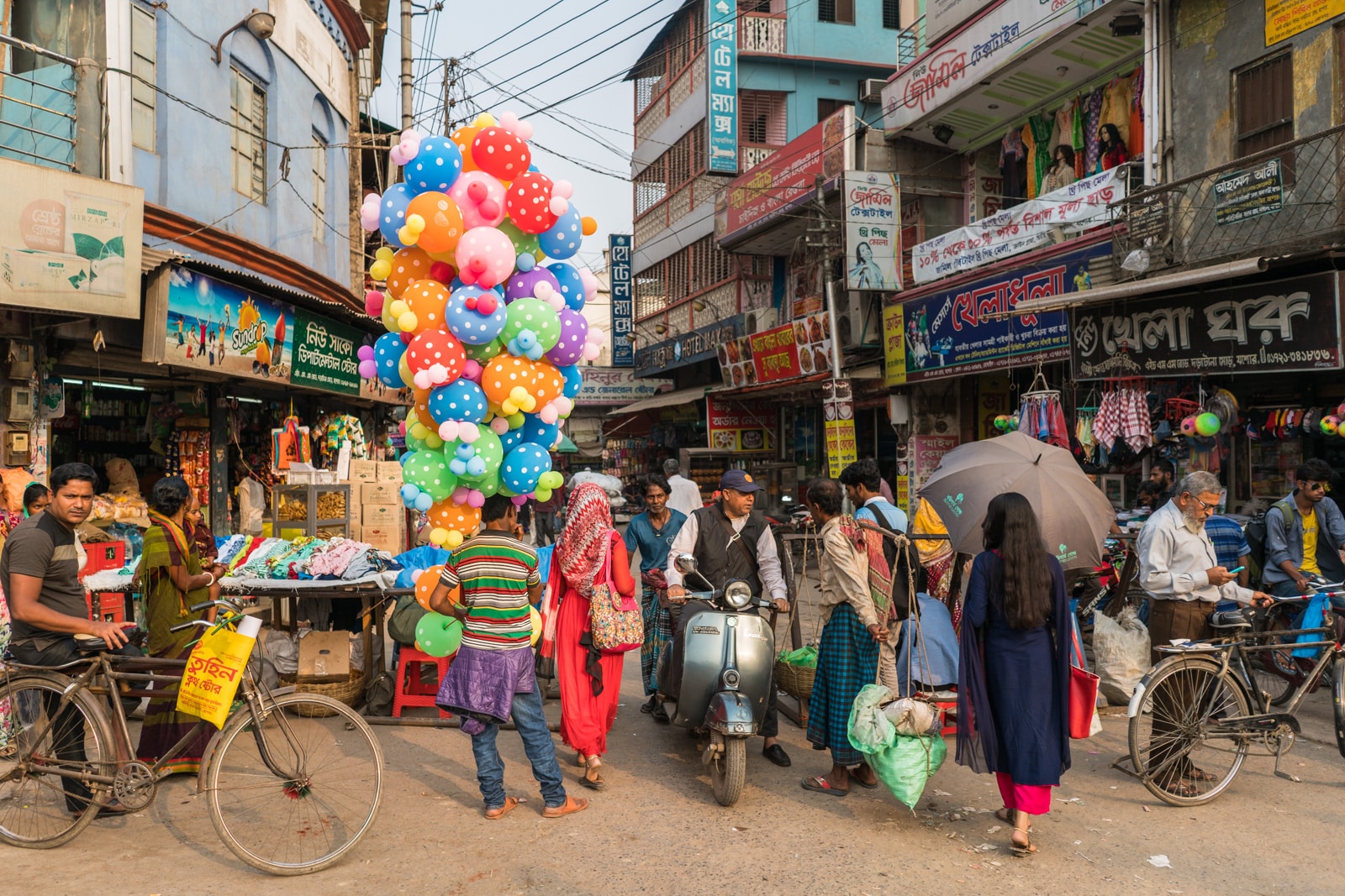 Backpacking in Bangladesh travel guide - Rainbow balloon salesman in central Jessore - Lost With Purpose travel blog