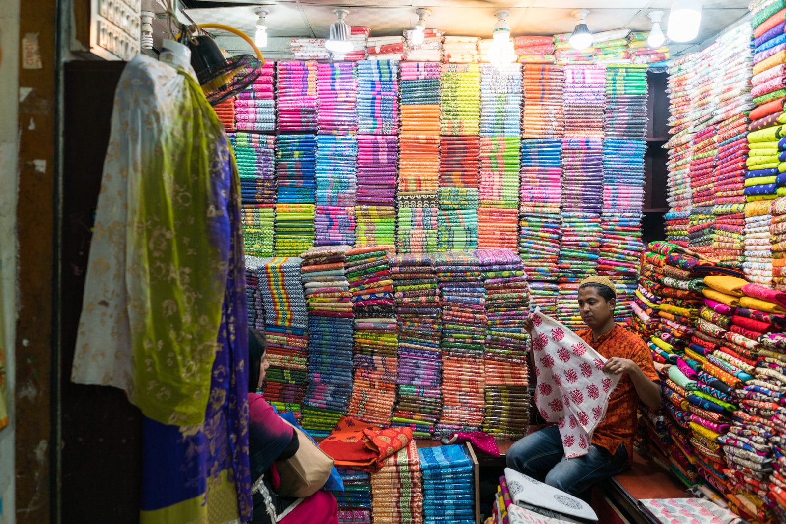 Backpacking Bangladesh travel guide - Colorful fabrics on sale in New Market, Dhaka - Lost With Purpose travel blog