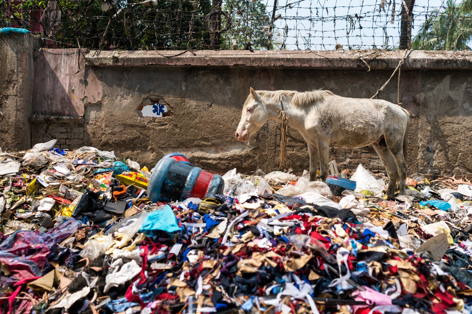 Easy ways to be a more responsible traveler - Pile of trash on the streets of Dhaka, Bangladesh - Lost With Purpose travel blog