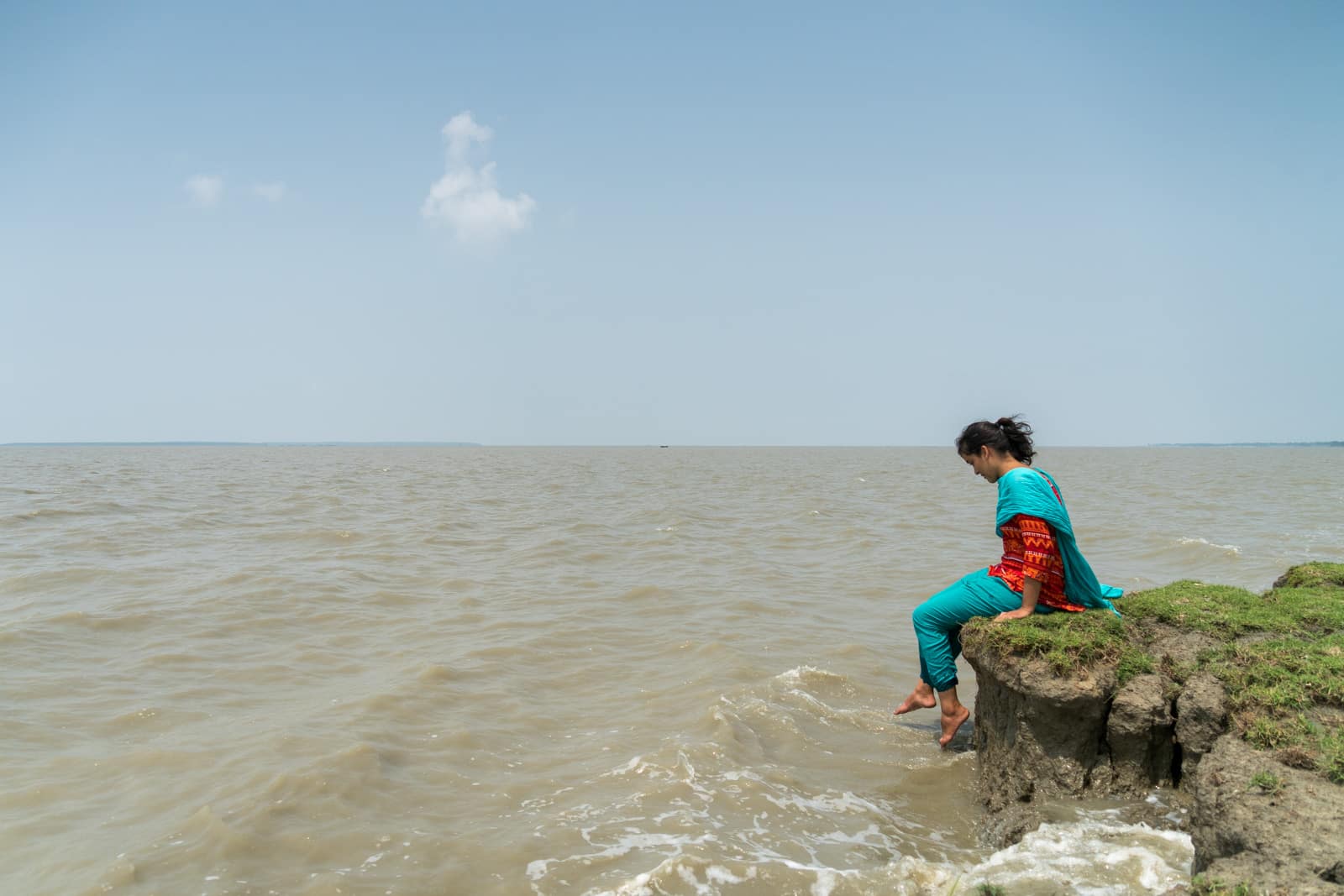 Is Bangladesh safe for solo female travelers - Chilling on the Meghna river bank on Manpura island - Lost With Purpose travel blog