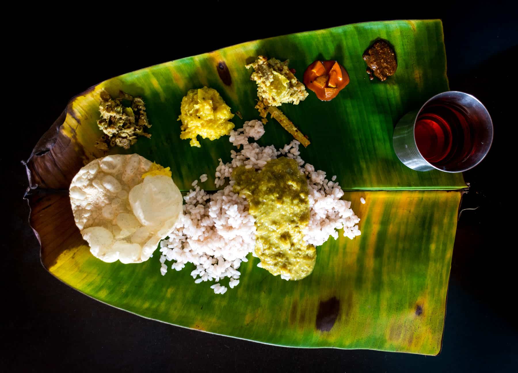 Easy ways to travel more responsibly - South Indian rice thali on a banana leaf - Lost With Purpose travel blog