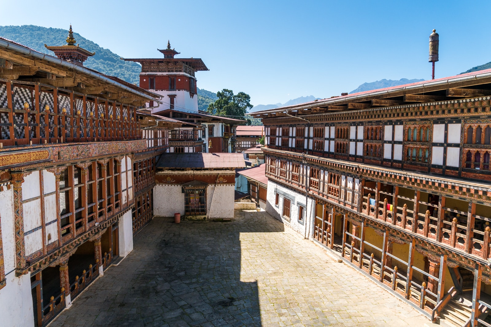 Stunning photos of Bhutan - Trongsa dzong interior with blue sky - Lost With Purpose travel blog