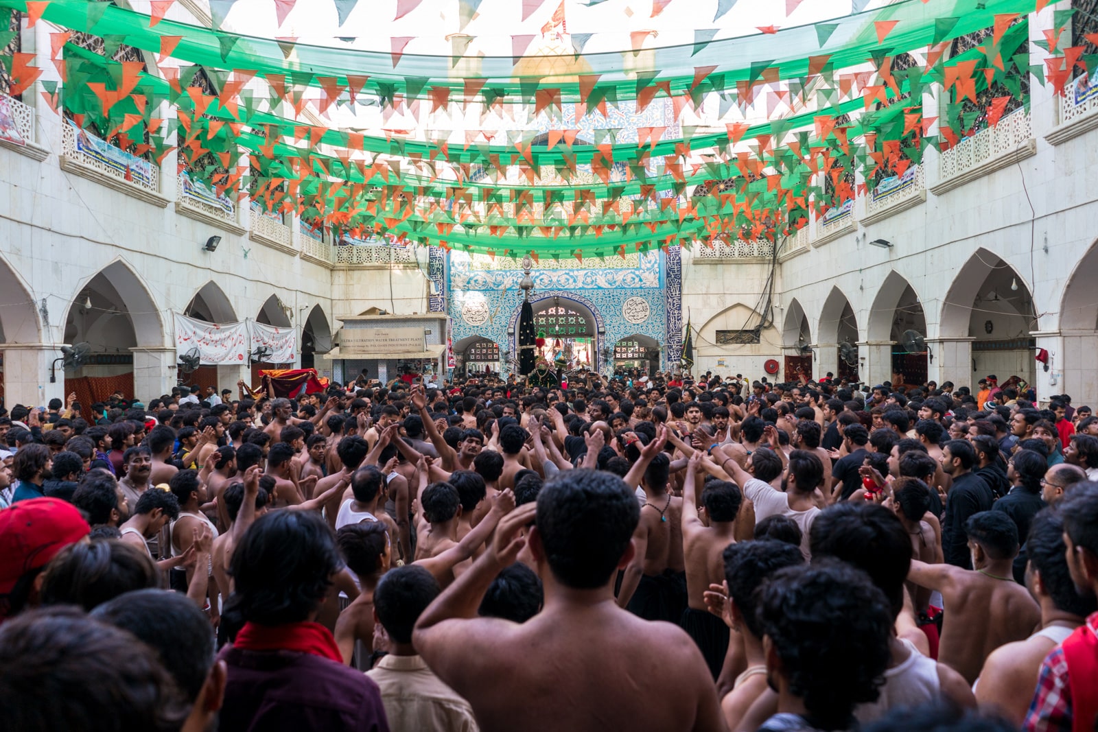 The Urs of Lal Shahbaz Qalandar in Sehwan, Pakistan - Crowd of Shias doing self flagellation outside the shrine - Lost With Purpose travel blog