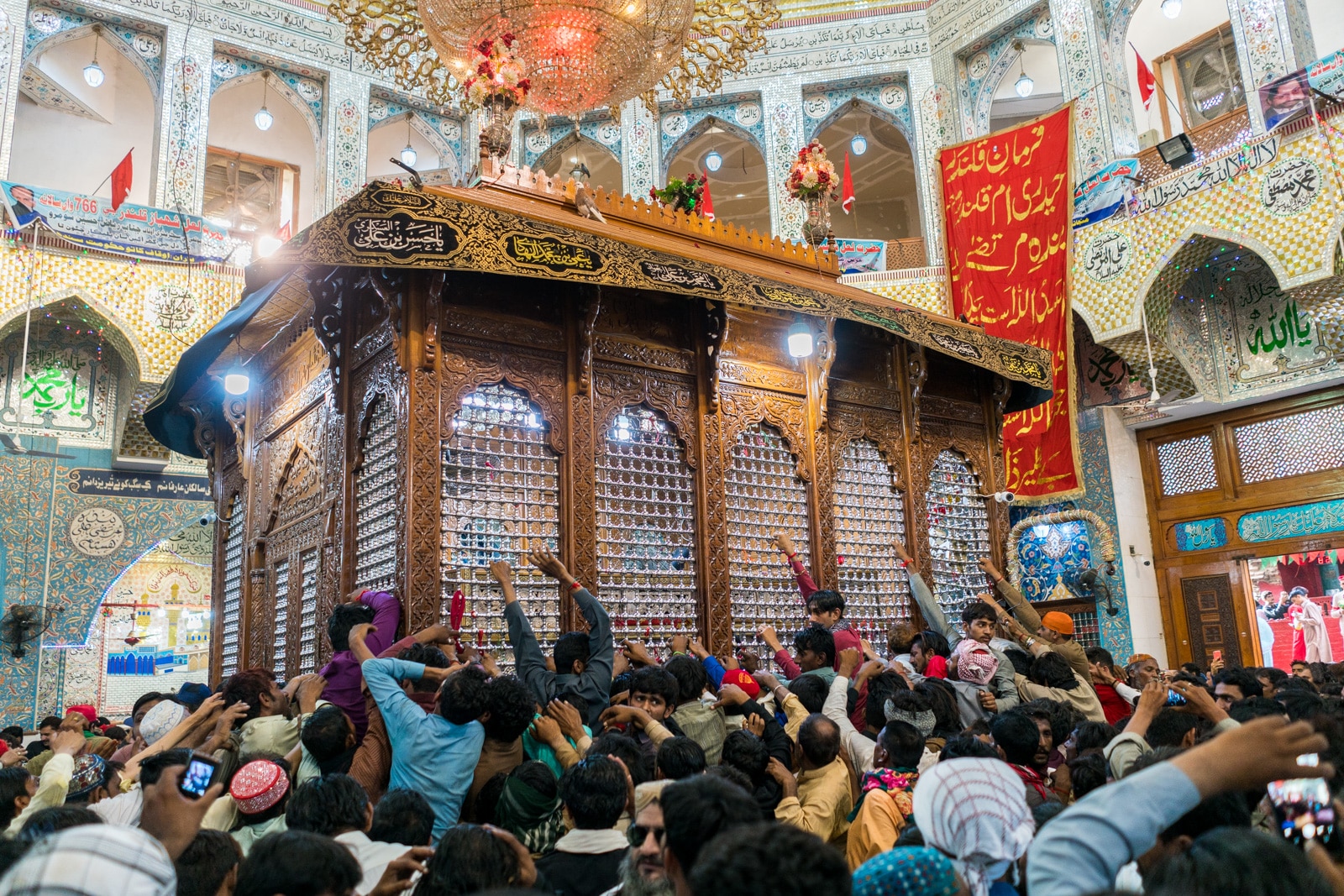 The Urs of Lal Shahbaz Qalandar in Sehwan, Pakistan - Devotees trying to touch the shrine - Lost With Purpose travel blog