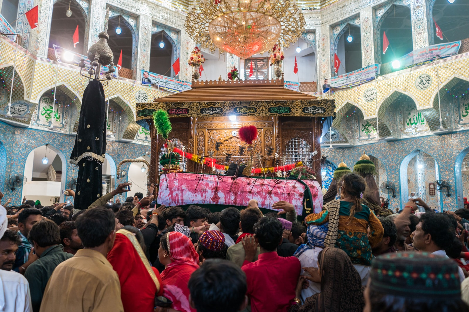 The Urs of Lal Shahbaz Qalandar in Sehwan, Pakistan - Shia coffin circling the tomb - Lost With Purpose travel blog