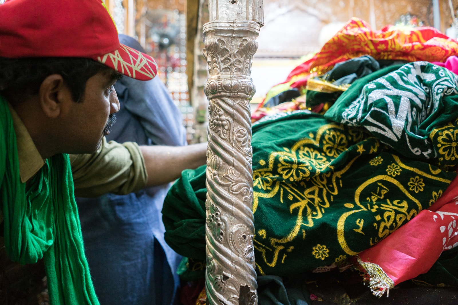 The Urs of Lal Shahbaz Qalandar in Sehwan, Pakistan - Man touching tomb - Lost With Purpose travel blog