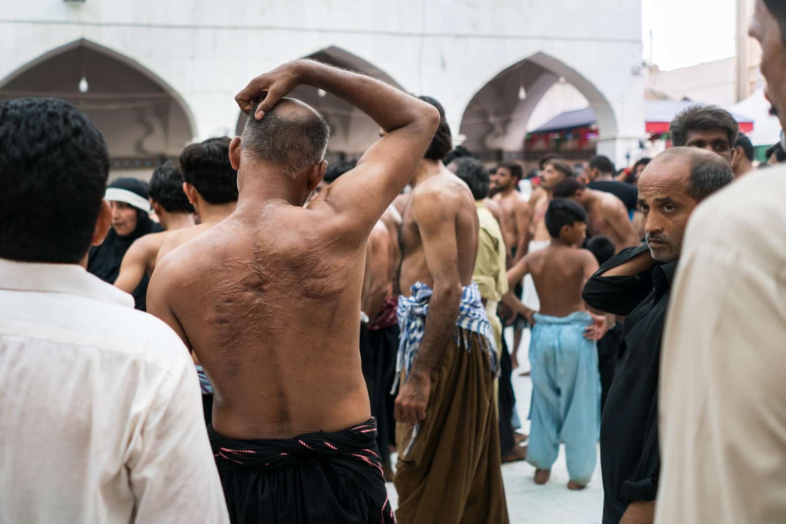 The Urs of Lal Shahbaz Qalandar in Sehwan, Pakistan - Scars on the back of a Shia man - Lost With Purpose travel blog