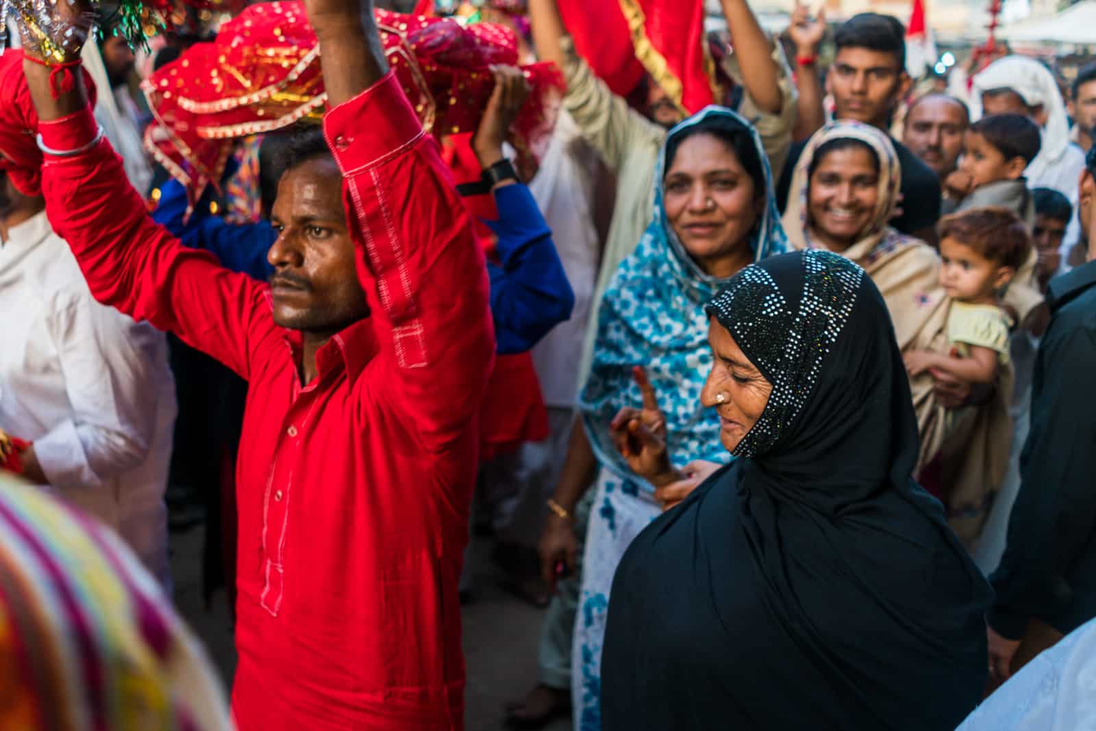 The Urs of Lal Shahbaz Qalandar in Sehwan, Pakistan - Woman in the crowd - Lost With Purpose travel blog