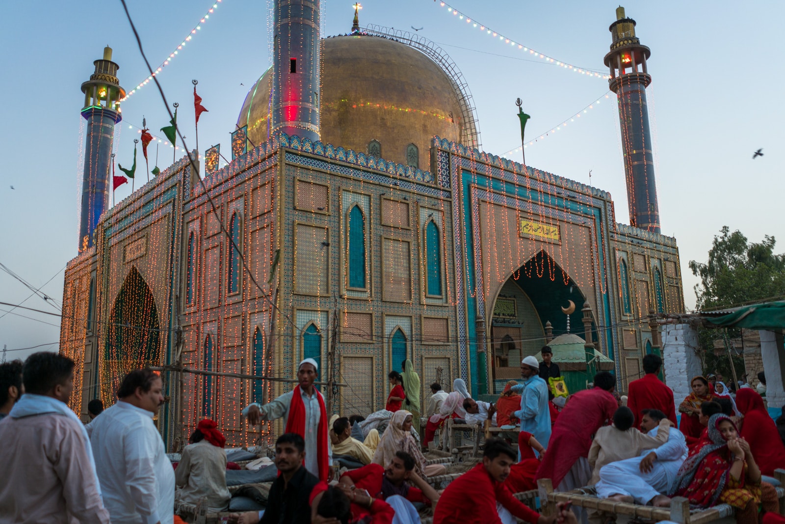 The Urs of Lal Shahbaz Qalandar in Sehwan, Pakistan - Crowds watching the dhamaal from a rooftop near the shrine - Lost With Purpose travel blog