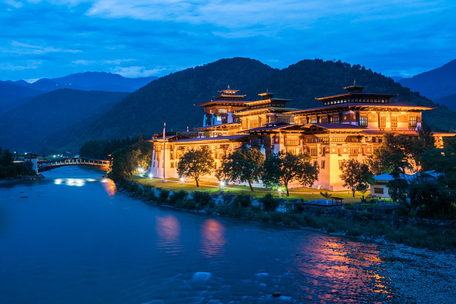 Photos of Bhutan - Punakha dzong lit up at night - Lost With Purpose travel blog