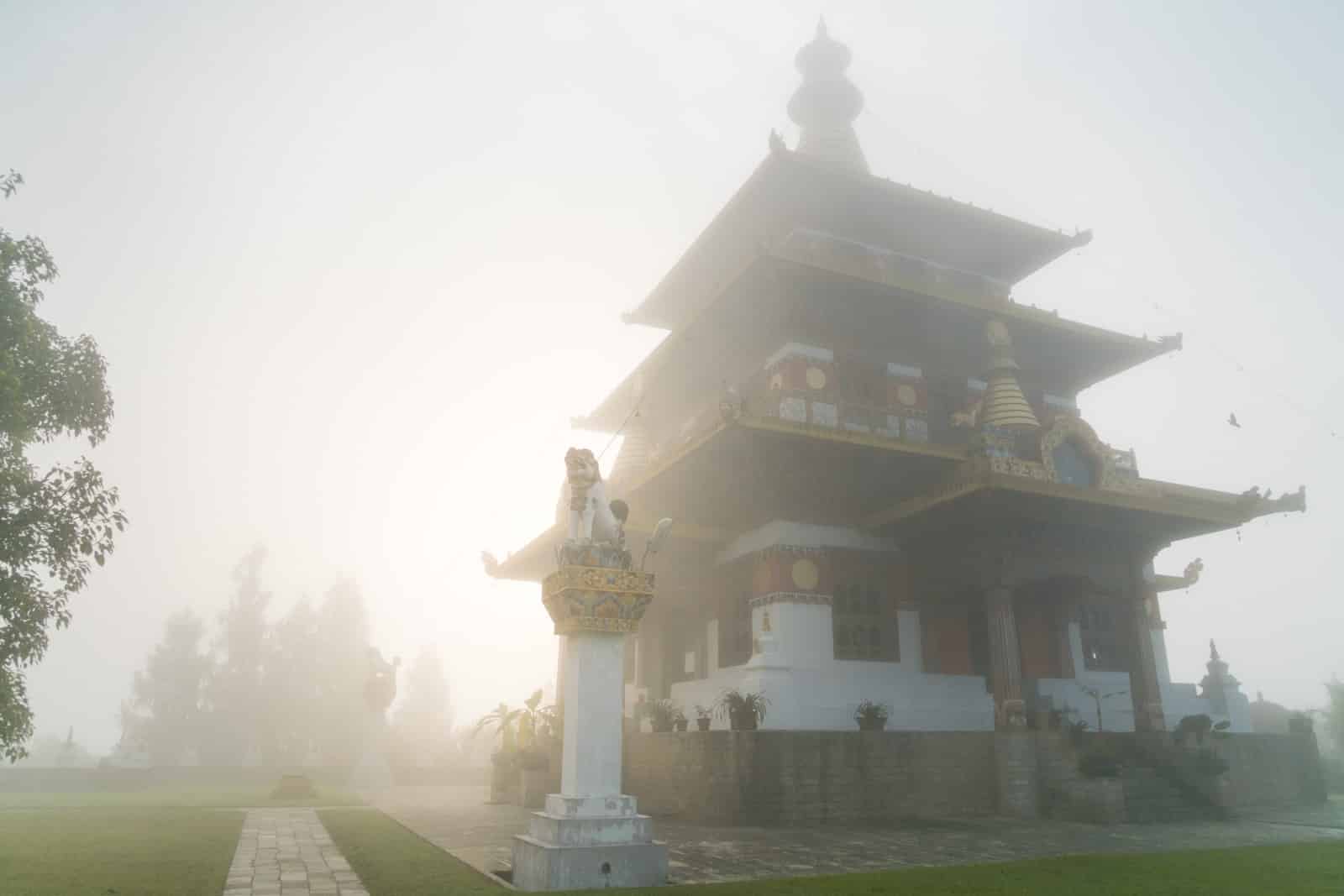 Photos of Bhutan - Fog over Khamsum Yulley Namgyal Chorten near Punakha - Lost With Purpose travel blog