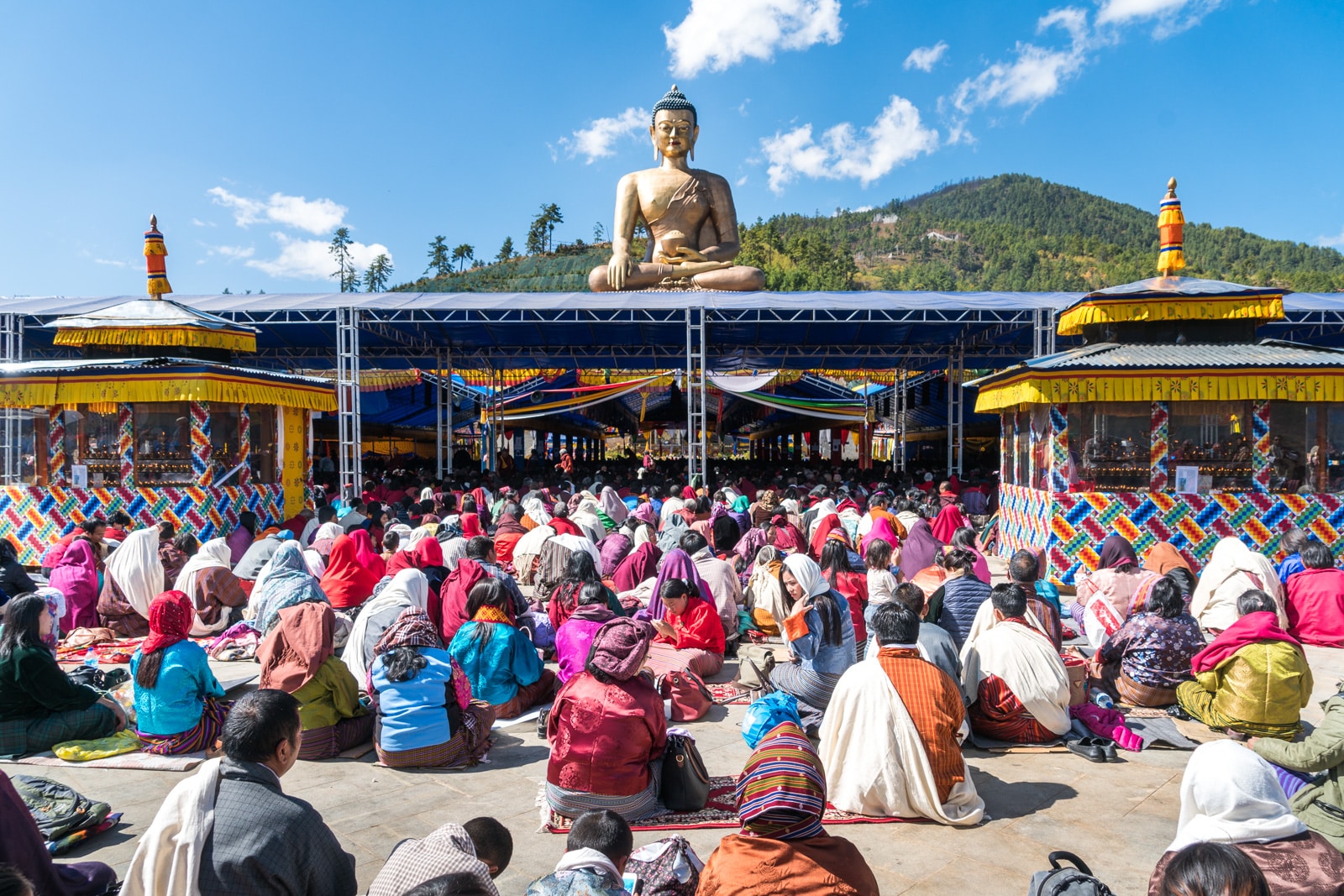 Photos of Bhutan - Devotees sitting at a talk at Buddha Point in Thimphu - Lost With Purpose travel blog