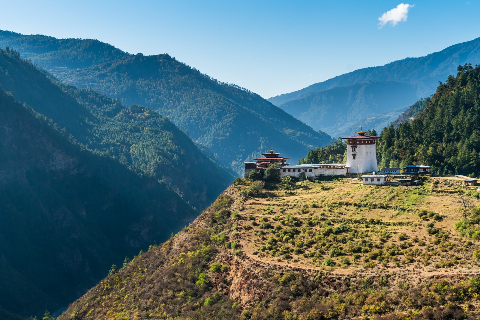 Photos of Bhutan - Dzong on a hill on the way to Haa Valley - Lost With Purpose travel blog