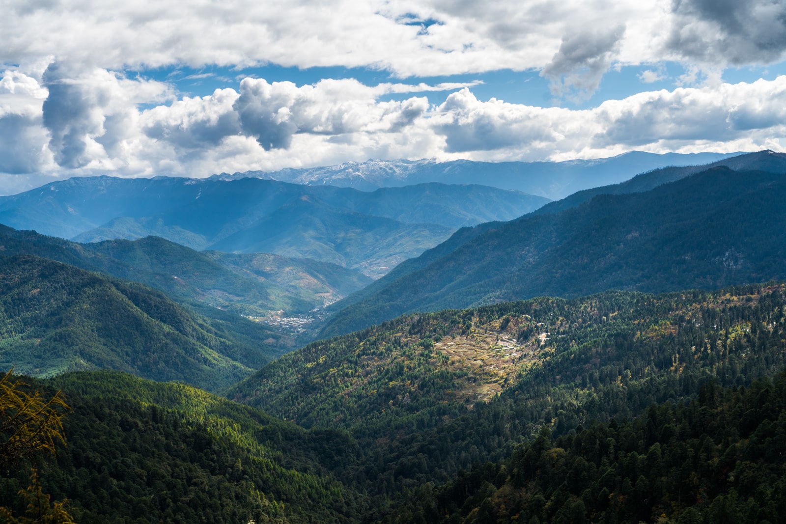 Stunning photos of Bhutan - Clouds over valley along the Druk Path between Thimphu and Paro - Lost With Purpose travel blog