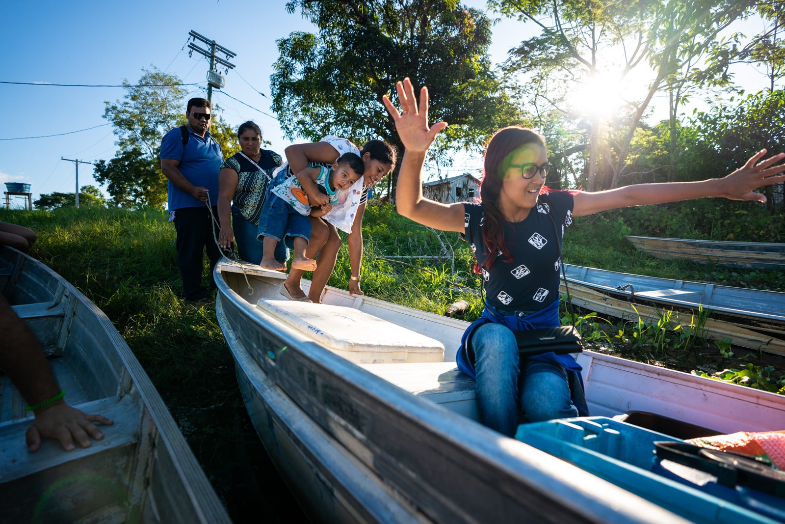 OneSight's mobile eye care clinic in the Brazilian Amazon - Family getting onto a boat to go home - Lost With Purpose travel blog