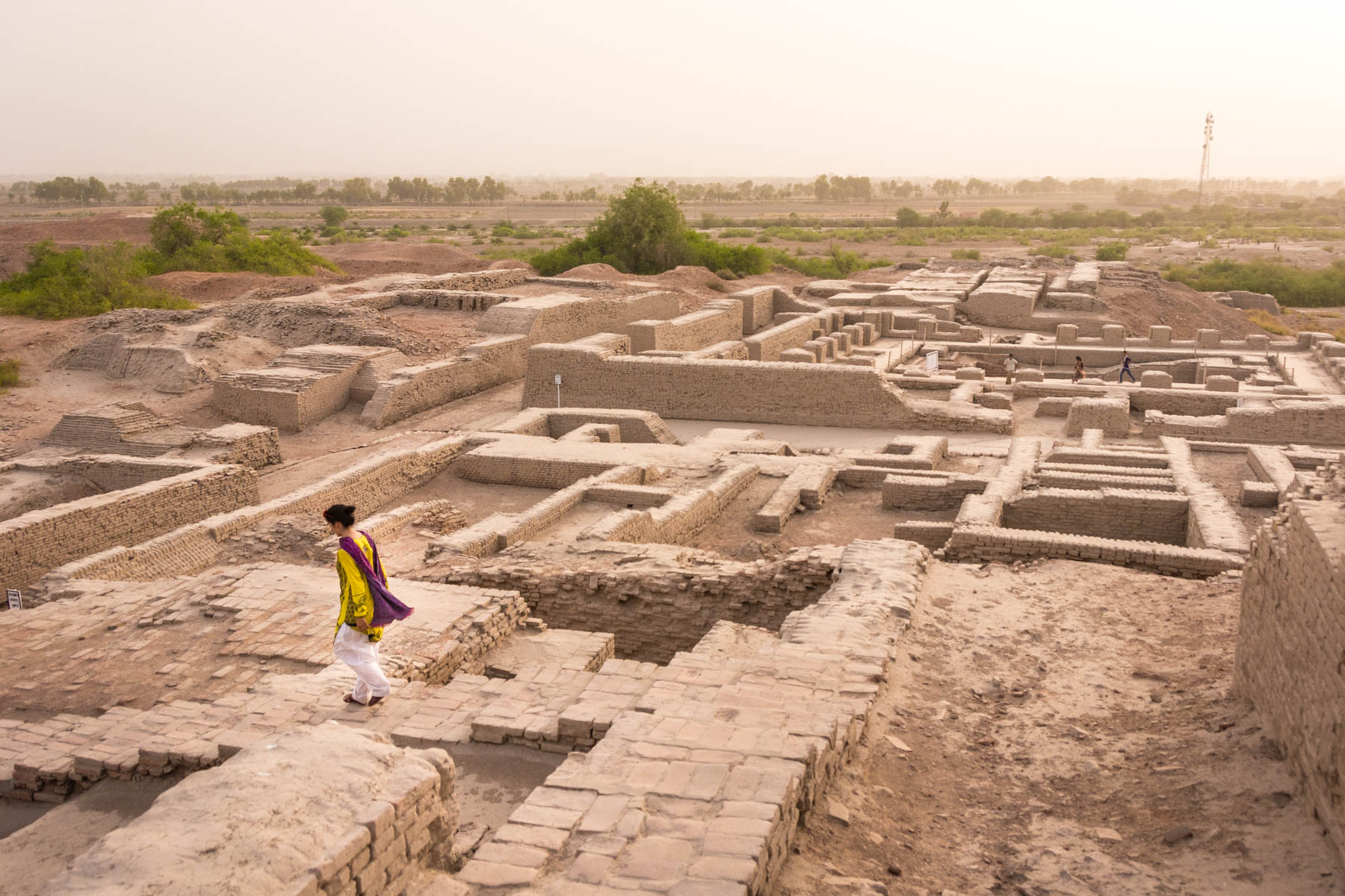 Pakistan bucket list - Girl exploring Moenjodaro ruins in Sindh - Lost With Purpose travel blog