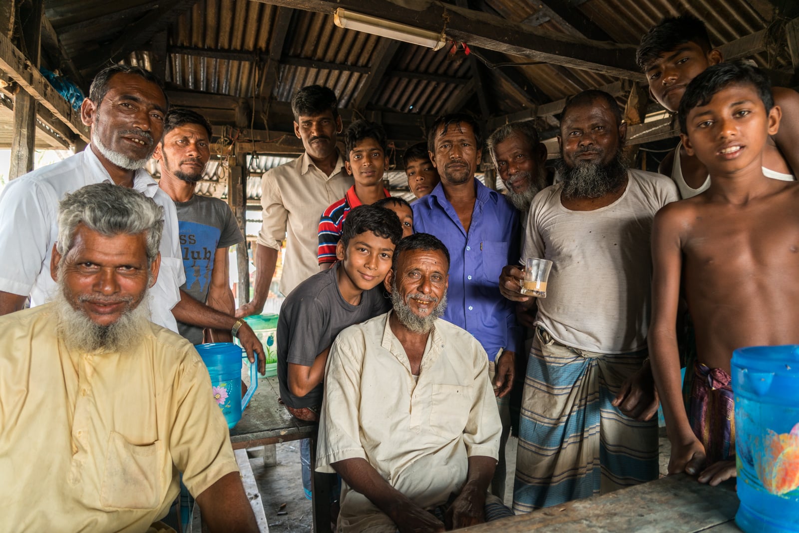 Reverse culture shock from long-term travel - Men watching me on Nijhum Dwip island, Bangladesh - Lost With Purpose travel blog