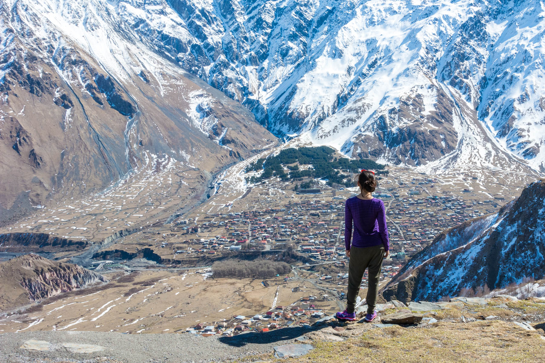 How I afford full-time travel - Alex admiring the view of Kazbegi, Georgia in 2016 - Lost With Purpose travel blog