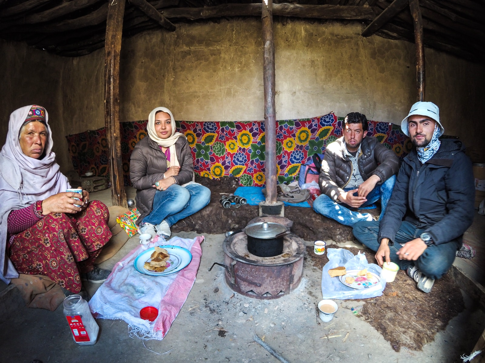 Bossy travelers interview with Aneeqa, head of Pakistan's first female-run tour company - Aneeqa with a local family in Hunza