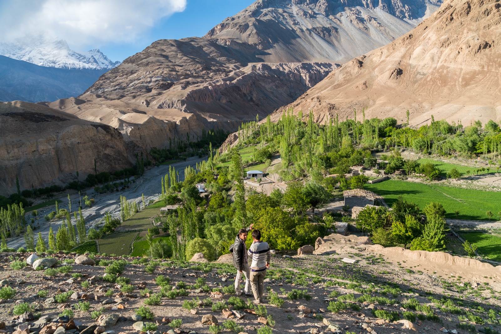 Ways to get more off the beaten track while traveling - Setting sun as boys climb a mountain in Yasin Valley, Pakistan - Lost With Purpose travel blog