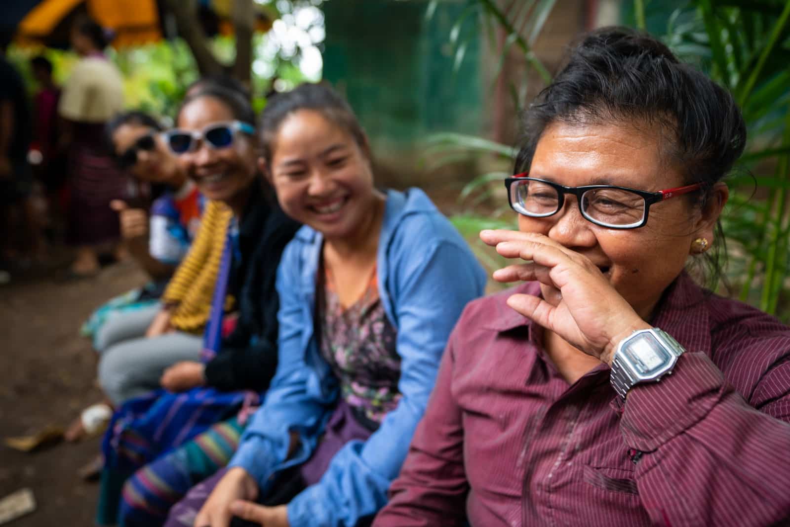 OneSight eye care clinic on the Thailand-Myanmar border - Woman with glasses laughing and smiling - Lost With Purpose travel blog