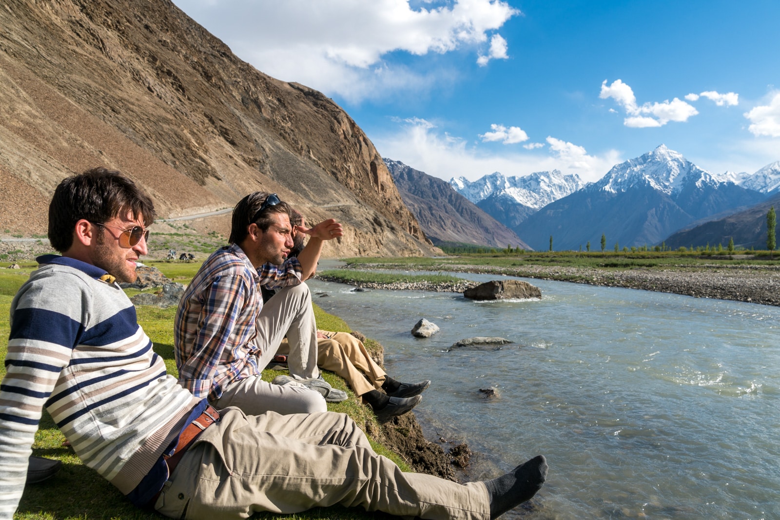 Reflections - Boys sitting next to a river in Yasin Valley, Pakistan - Lost With Purpose travel blog