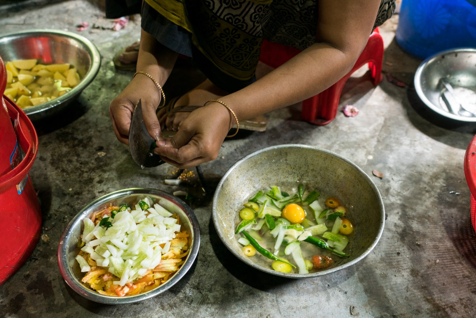 Reflections - Hands preparing lunch on Monpura island, Bangladesh - Lost With Purpose travel blog