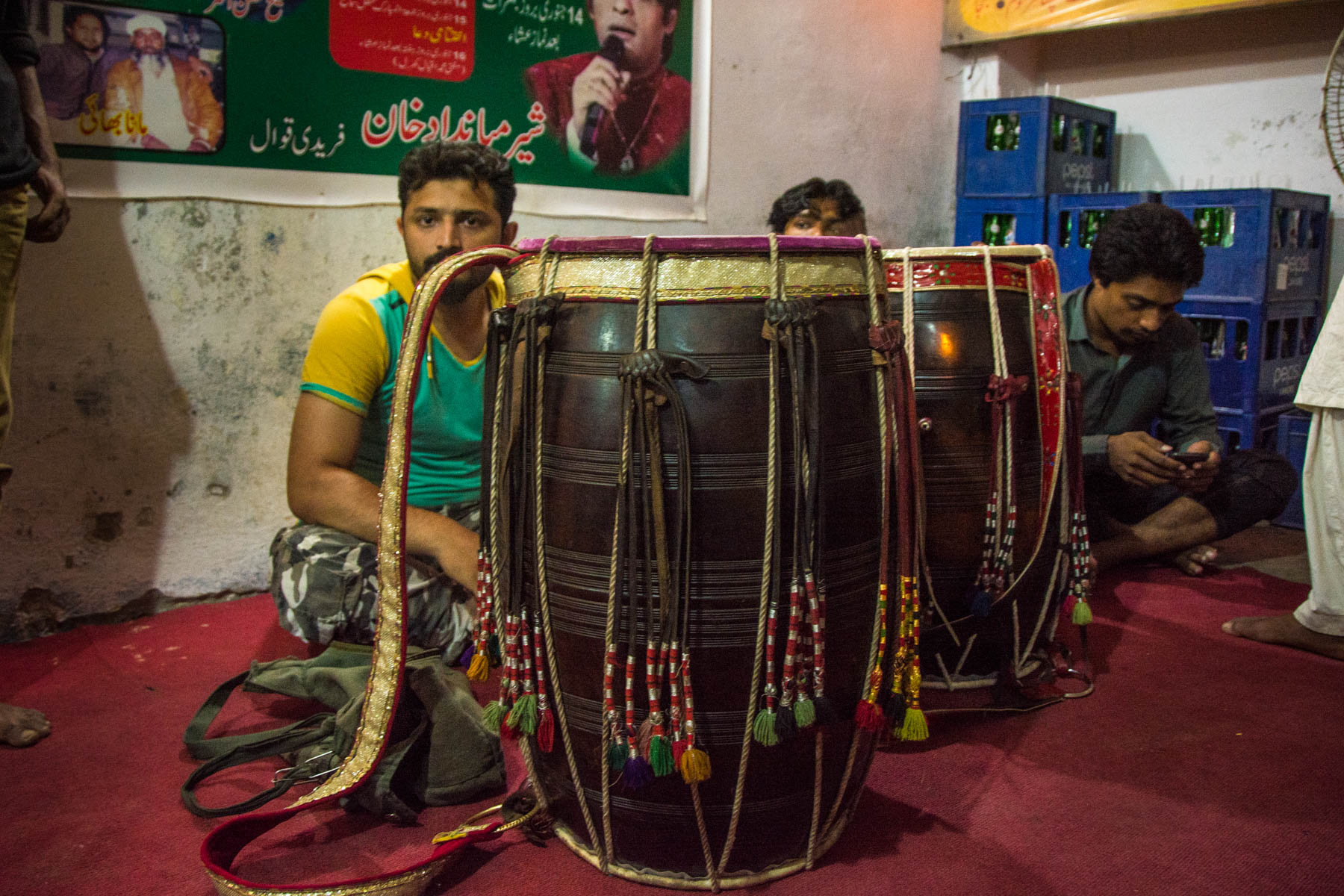 Sufi dhamal in Lahore - Dhol drums and drummers waiting to play at Shah Jamal shrine - Lost With Purpose travel blog