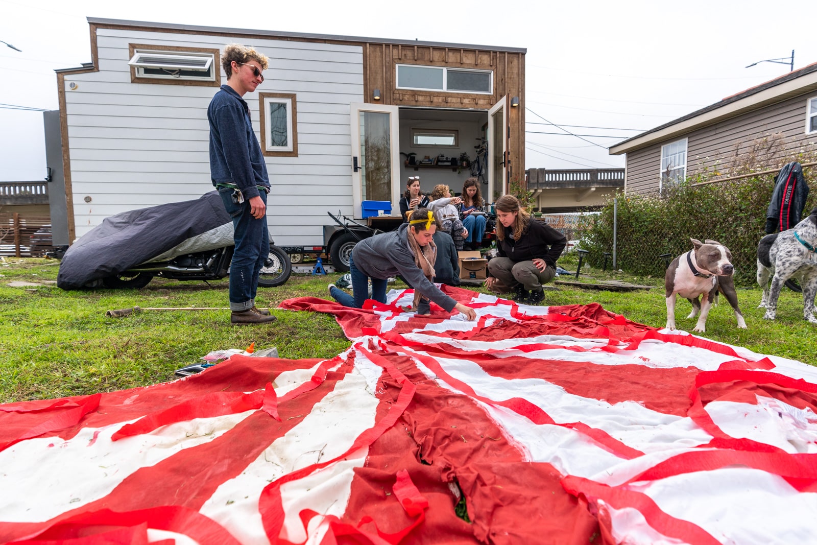 Putting together a red and white striped circus tent for a Mardi Gras parade float - Lost With Purpose travel blog