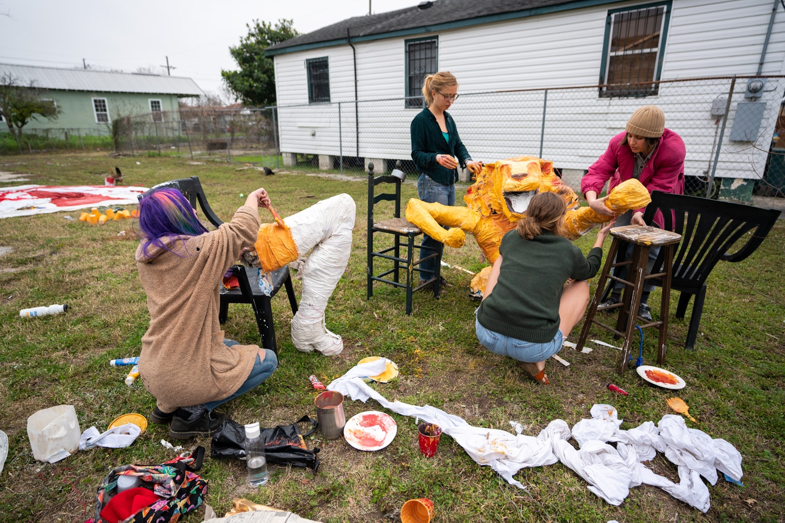 Painting a plaster lioness for a Mardi Gras parade in New Orleans, LA