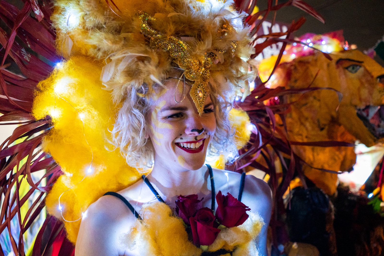 Girl dressed as a light up lion in a Mardi Gras parade in New Orleans