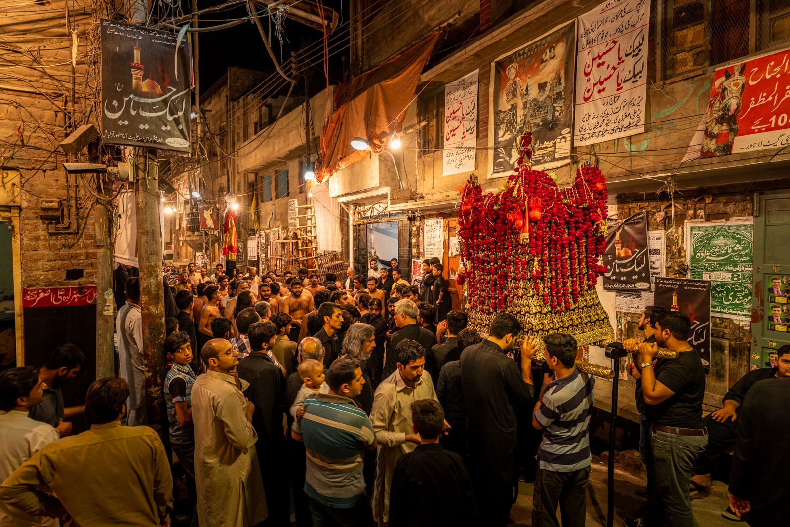 Unique things to do in Lahore, Pakistan - Shia Muharram procession at night in the Walled City of Lahore, Pakistan