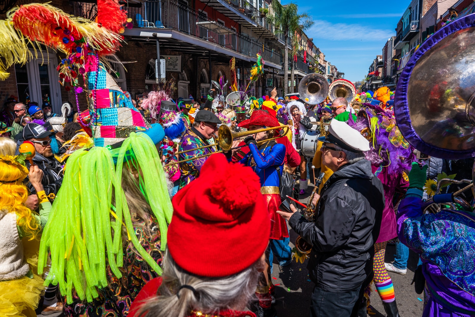 Paraders in costume in the French Quarter during Mardi Gras day in New Orleans