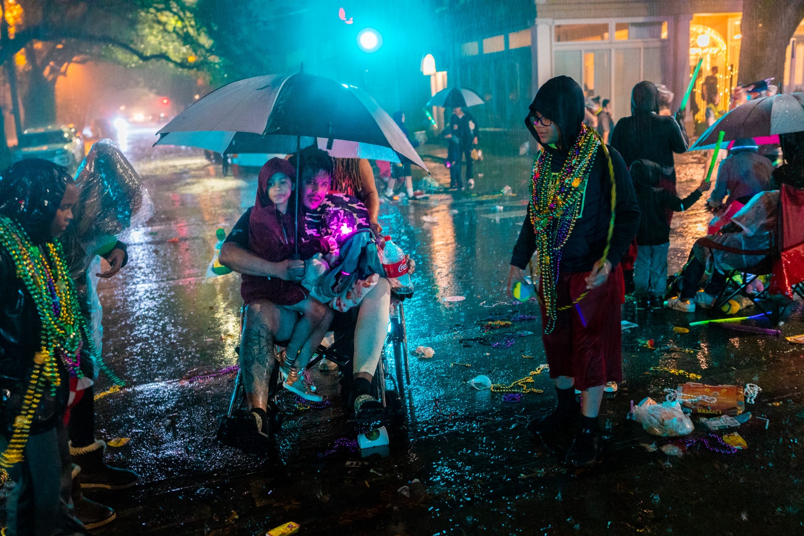 Family out in the rain at a Mardi Gras parade