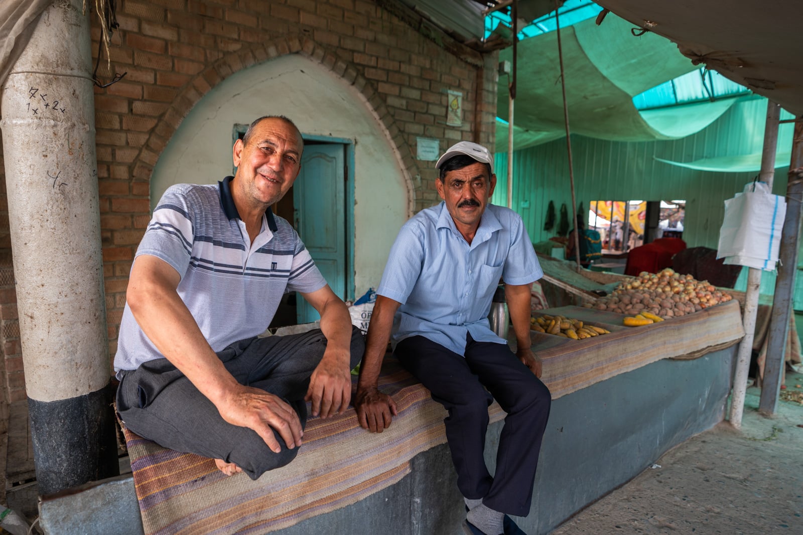 Two Tajik men sitting in the Panjakent bazaar, Tajikistan