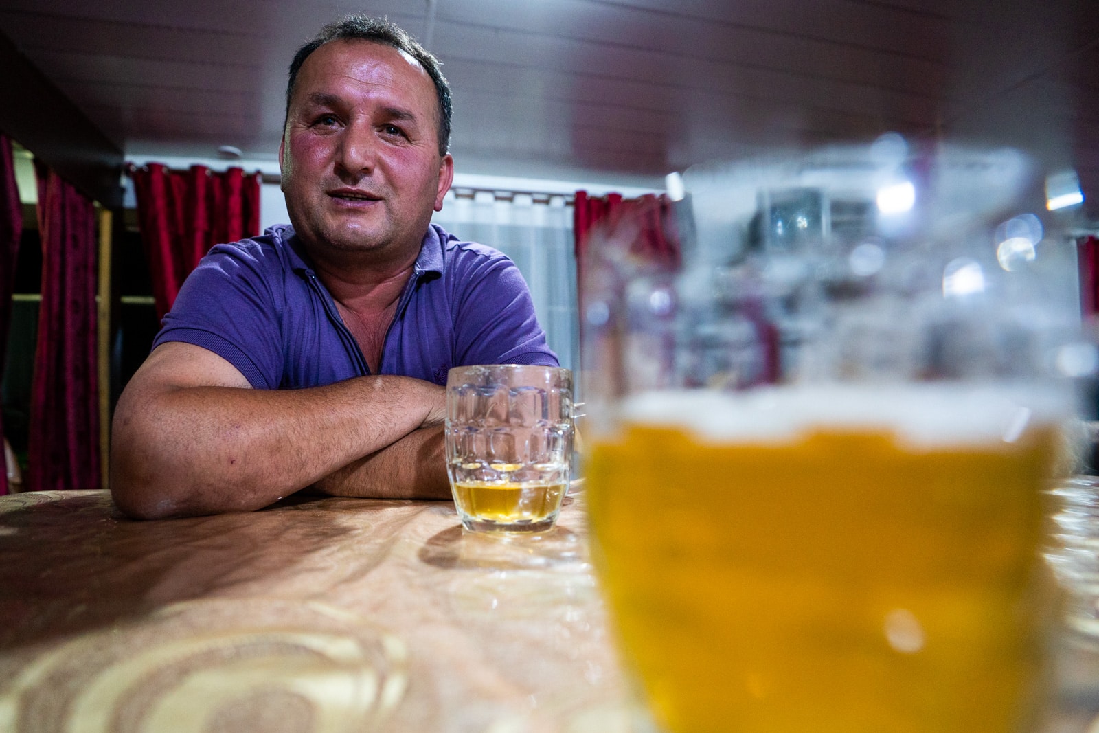 Tajik man with beer in Khorog, Tajikistan