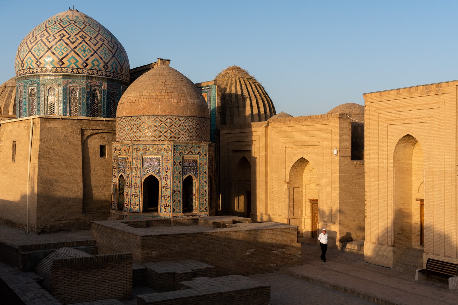 Man walking in early morning at Shah-i-Zinda necropolis, Samarkand, Uzbekistan
